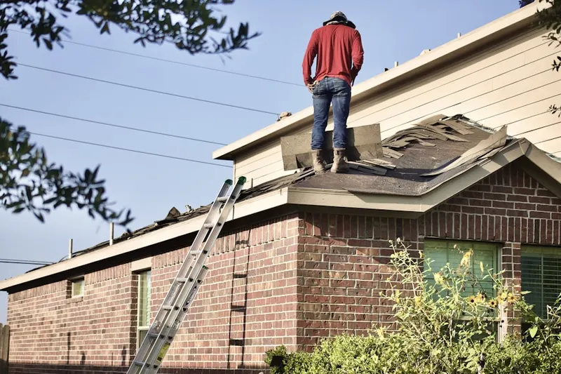Professional roofer working on a residential roof in Heritage District